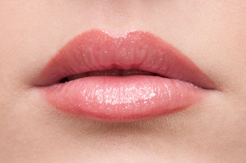 Close-up lips with lip balm on it